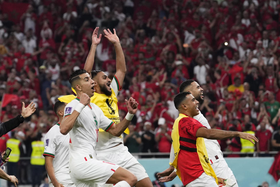 Morocco players celebrate at the end of the World Cup group F soccer match between Canada and Morocco at the Al Thumama Stadium in Doha , Qatar, Thursday, Dec. 1, 2022. (AP Photo/Manu Fernandez)