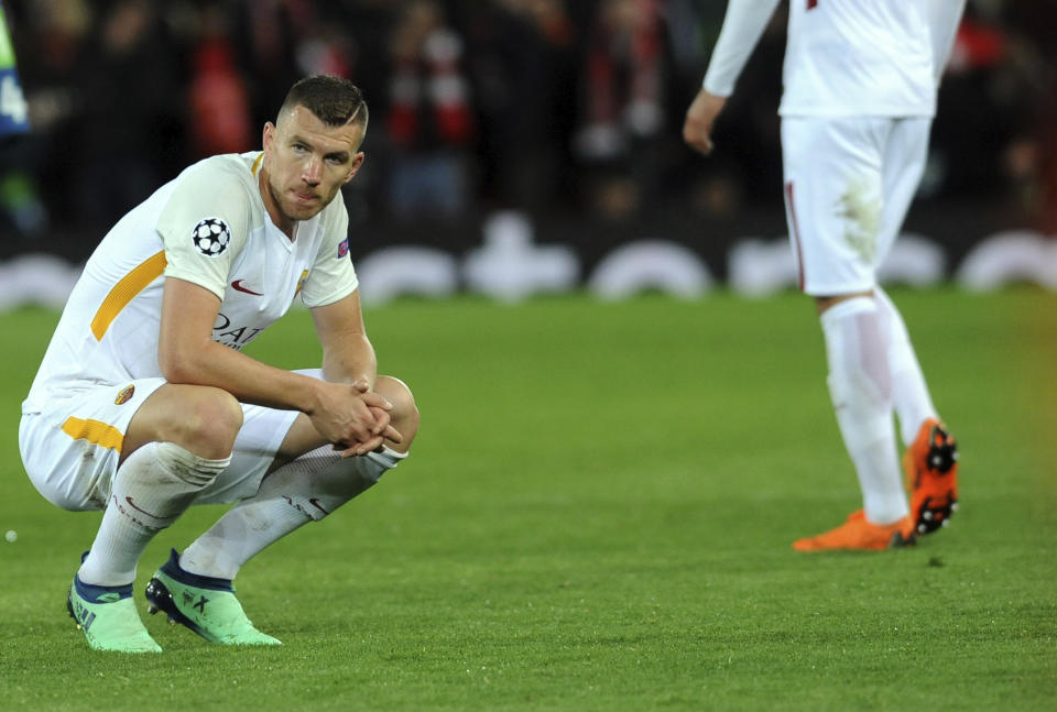 Still in with a chance: Edin Dzeko gave Roma hope as the Reds lost focus late on