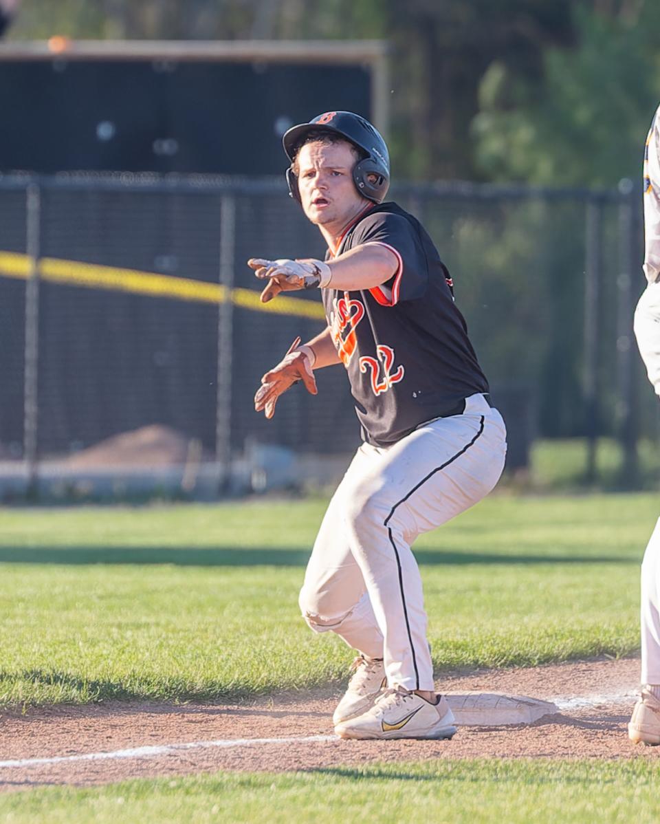 Brighton's Lane Petit celebrates his tie-breaking triple in the 10th inning of a 5-3 victory over Hartland Wednesday, May 1, 2024.
