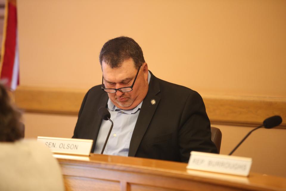 Sen. Rob Olson, R-Olathe, reviews a report from the Legislative Division of Post Audit on Kansas COVID-19 spending during a meeting Wednesday.