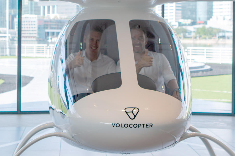 Skyports managing director Duncan Walker (left) and Volocopter CEO Florian Reuter gesturing to the media from inside a two-seat Volocopter electric air taxi during the VoloPort press conference on 21 October 2019. (PHOTO: Dhany Osman / Yahoo News Singapore)