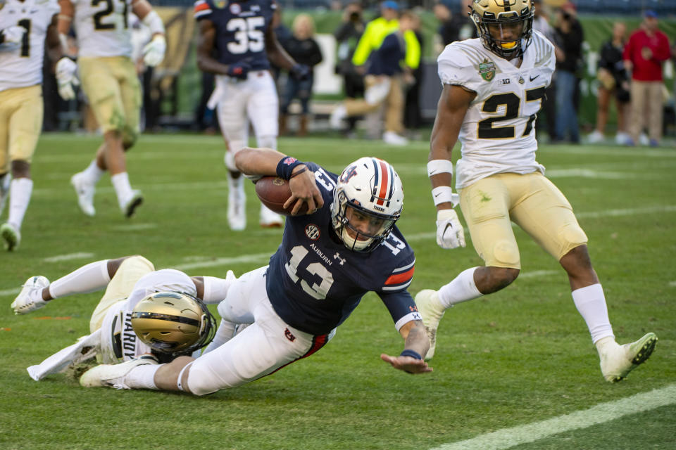 NASHVILLE, TN - DECEMBER 28: Joey Gatewood #13 of the Auburn Tigers is tackled at the goal line by Kamal Hardy #3 of the Purdue Boilermakers during the second half at Nissan Stadium on December 28, 2018 in Nashville, Tennessee. (Photo by Timothy Nwachukwu/Getty Images)