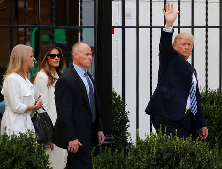 Republican U.S. presidential nominee Donald Trump (R), and his wife Melania Trump (2nd L) and his campaign manager Kellyanne Conway (L) depart after the grand opening of his new Trump International Hotel in Washington, U.S. October 26, 2016. REUTERS/Jonathan Ernst