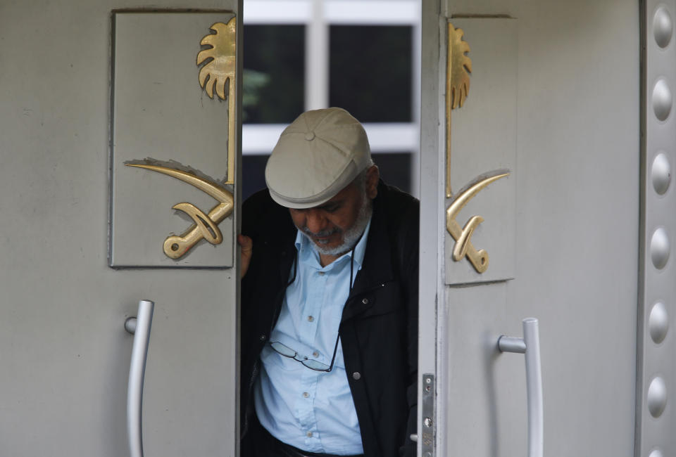 A man exits Saudi Arabia's consulate in Istanbul, Wednesday, Oct. 10, 2018. Turkish officials have said they believe Saudi writer and government critic Jamal Khashoggi, was killed inside the consulate after he visited the mission to obtain a document required to marry his Turkish fiancee. Saudi Arabia has denied the allegations. (AP Photo/Lefteris Pitarakis)