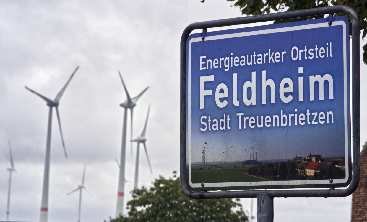 Wind turbines turn near the village of Feldheim near Treuenbrietzen, Germany, (AP Photo/Michael Sohn)