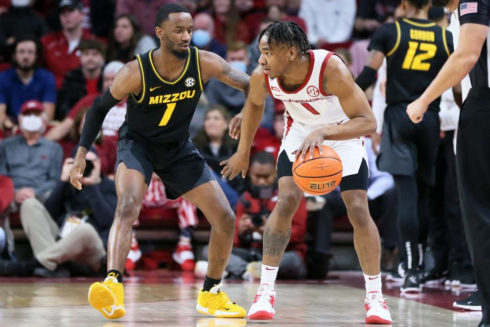 Jan 12, 2022; Fayetteville, Arkansas, USA; Arkansas Razorbacks guard JD Notae (1) moves against Missouri Tigers guard Anton Brookshire (0) during the first half at Bud Walton Arena. Mandatory Credit: Nelson Chenault-USA TODAY Sports