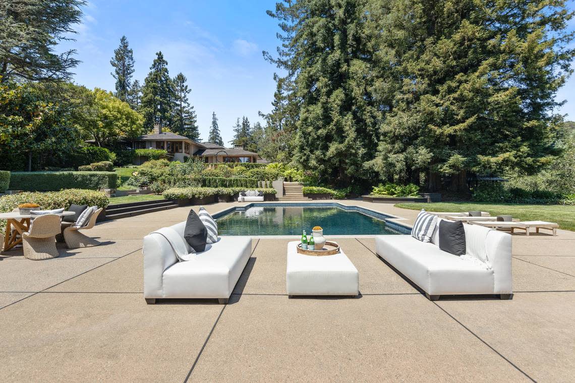 The pool is just one of multiple outdoor seating areas in a San Francisco Bay Area home built for entertaining.