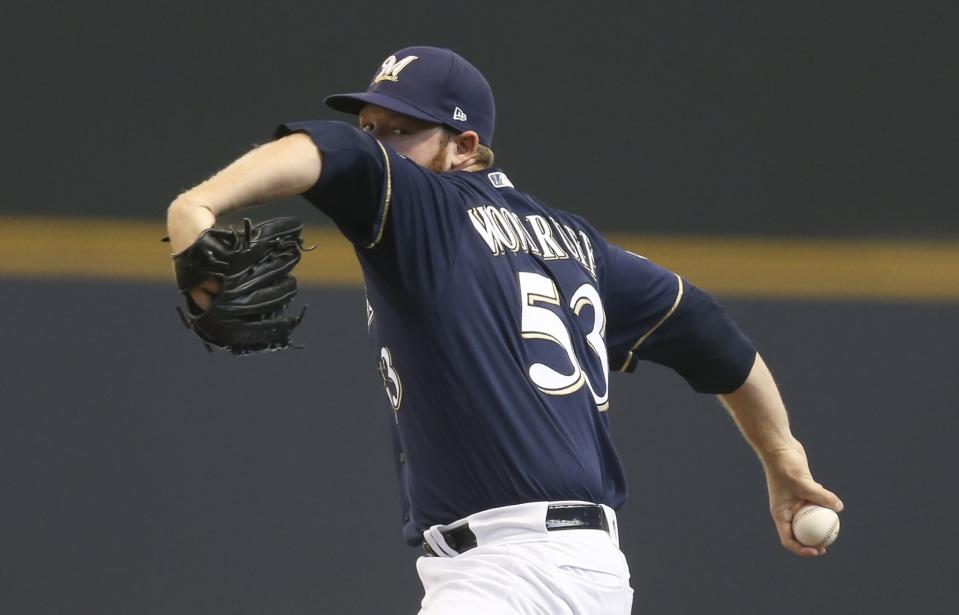 Milwaukee Brewers starting pitcher Brandon Woodruff throws during the first inning of Game 1 of the National League Divisional Series baseball game against the Colorado Rockies Thursday, Oct. 4, 2018, in Milwaukee. (AP Photo/Dylan Buell, pool)