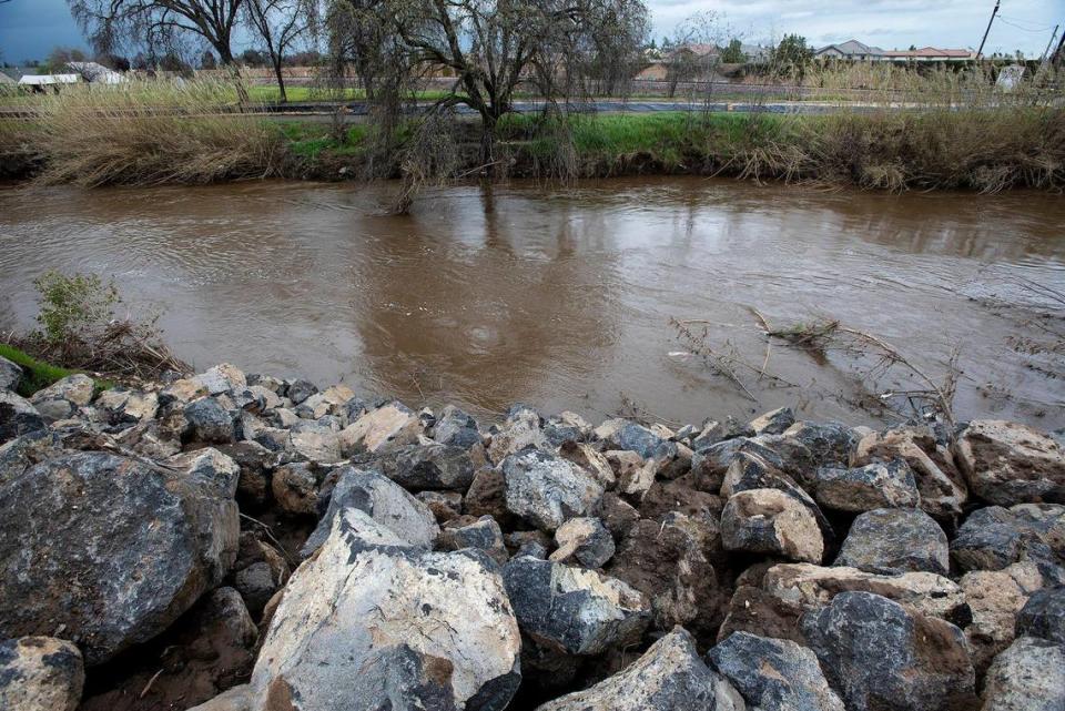 A reinforced section of creek bank along Bear Creek near West 23rd Street in Merced, Calif., on Tuesday, March 14, 2023.