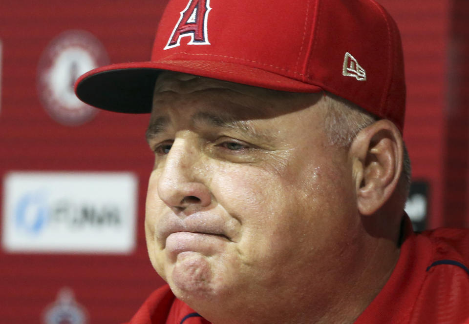 Los Angeles Angels manager Mike Scioscia announces that he will not return as Angels manager after 19 seasons, ending the longest current tenure in Major League baseball, following his last game, a 5-4 win over the Oakland Athletics in Anaheim, Calif., Sunday, Sept. 30, 2018. (AP Photo/Reed Saxon)