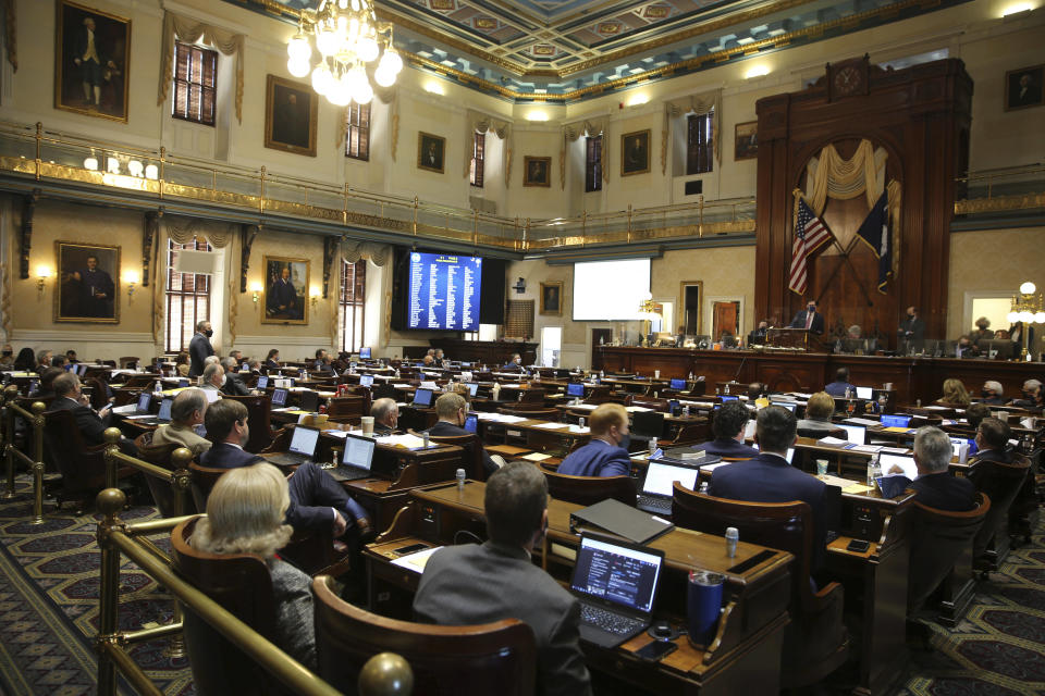 A number of empty seats are seen in the South Carolina House chamber on Wednesday, Feb. 17, 2021 in Columbia, S.C. Democrats walked out during the debate. (AP Photo/Jeffrey Collins)
