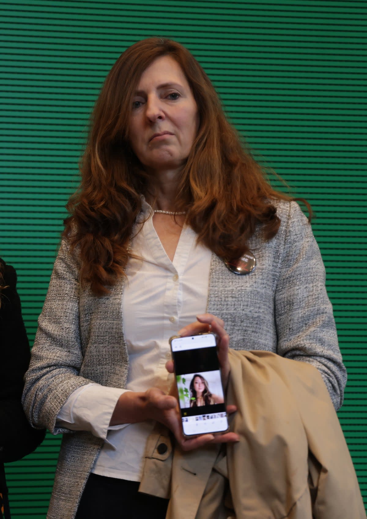 Ricarda Louk, mother of Gaza hostage Shani Louk, holds a portrait of Shani (Getty Images)