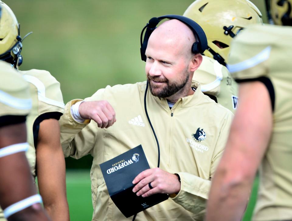 Wofford's head coach Josh Conklin on the field before a game.  