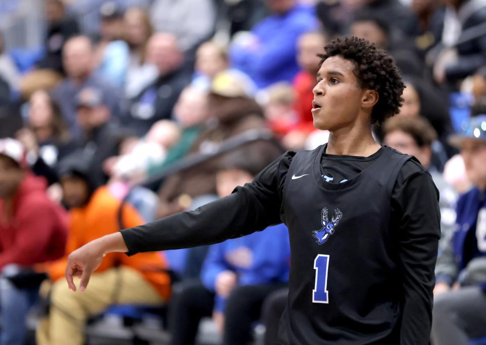 Deer Creek's Jaden Nartey reacts after a 3-point basket during the championship game of the Bruce Gray Invitational on Saturday at Deer Creek in Edmond.