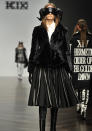 <b><b>London Fashion Week AW13:</b> KTZ<br><br></b>More odd face masks came in the form of this bizarre ram-horned creation. Loved the swinging black shiny skirt though.<br><br>©Rex