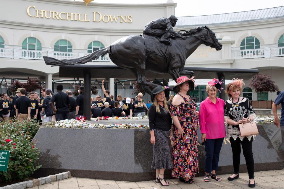 Visitors get their photograph taken with the Barbaro statue at the annual Thurby event at Churchill Downs for Louisville locals. May 2, 2019