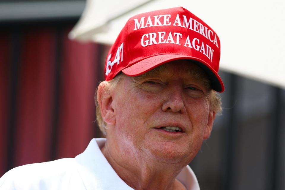 Trump dressed for a round of golf at his Miami Doral club a week before the start of his New York hush money trial in April (Megan Briggs/Getty)