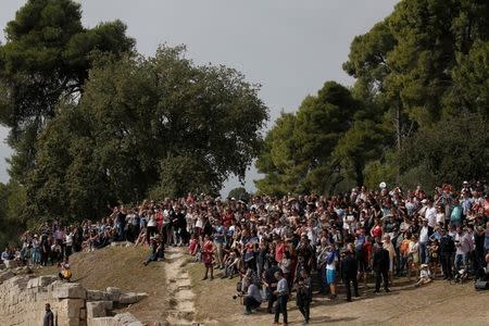 Olympics - Dress Rehearsal - Lighting Ceremony of the Olympic Flame Pyeongchang 2018 - Ancient Olympia, Olympia, Greece - October 23, 2017 Spectators during the dress rehearsal for the Olympic flame lighting ceremony for the Pyeongchang 2018 Winter Olympic Games at the site of ancient Olympia in Greece REUTERS/Costas Baltas