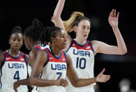United States' Ariel Atkins (7), center, celebrates with teammates after their win in the women's basketball preliminary round game against Japan at the 2020 Summer Olympics, Friday, July 30, 2021, in Saitama, Japan. (AP Photo/Charlie Neibergall)
