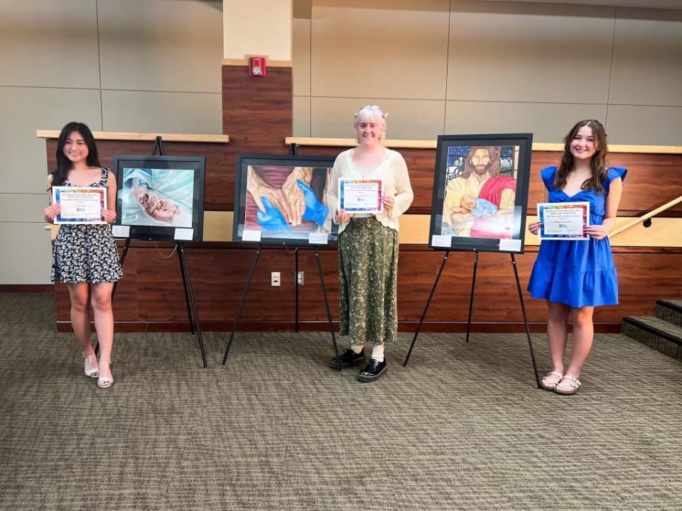 Yuna Iwai, Lucy Havery, and Abigail McMillen won the inaugural BSA Health System regional high school art competition.