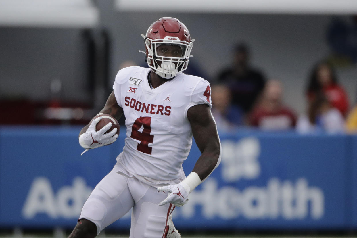 Oklahoma running back Trey Sermon runs during the first half of an NCAA college football game against Kansas Saturday, Oct. 5, 2019, in Lawrence, Kan. (AP Photo/Charlie Riedel)