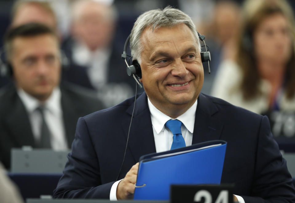 Hungary's Prime Minister Viktor Orban smiles at the European Parliament in Strasbourg, eastern France, Tuesday Sept.11, 2018. The European Parliament debates whether Hungary should face political sanctions for policies that opponents say are against the EU's democratic values and the rule of law. (AP Photo/Jean-Francois Badias)