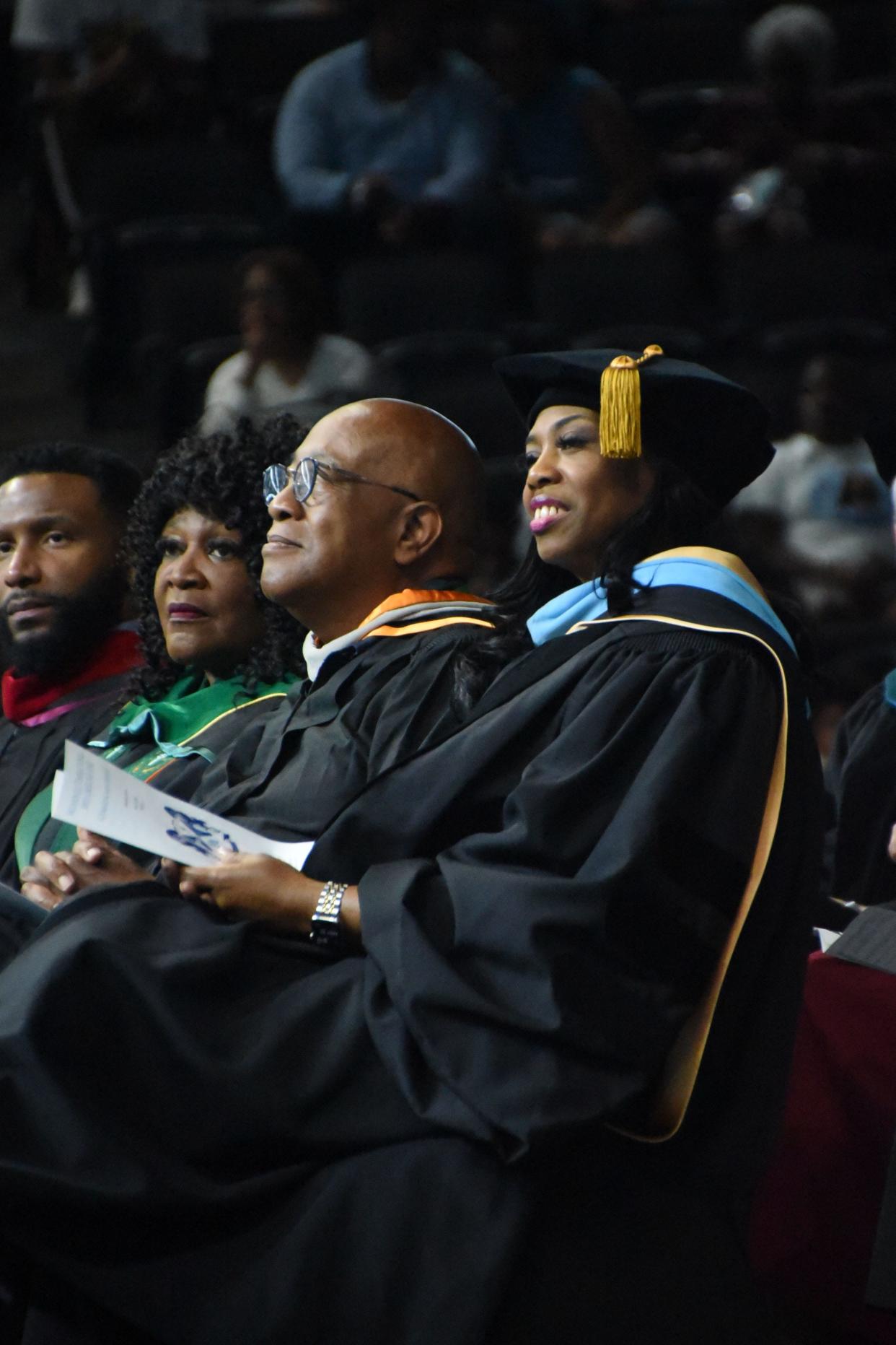 Superintendent Denise Watts smiles as graduates approach the stage in May.