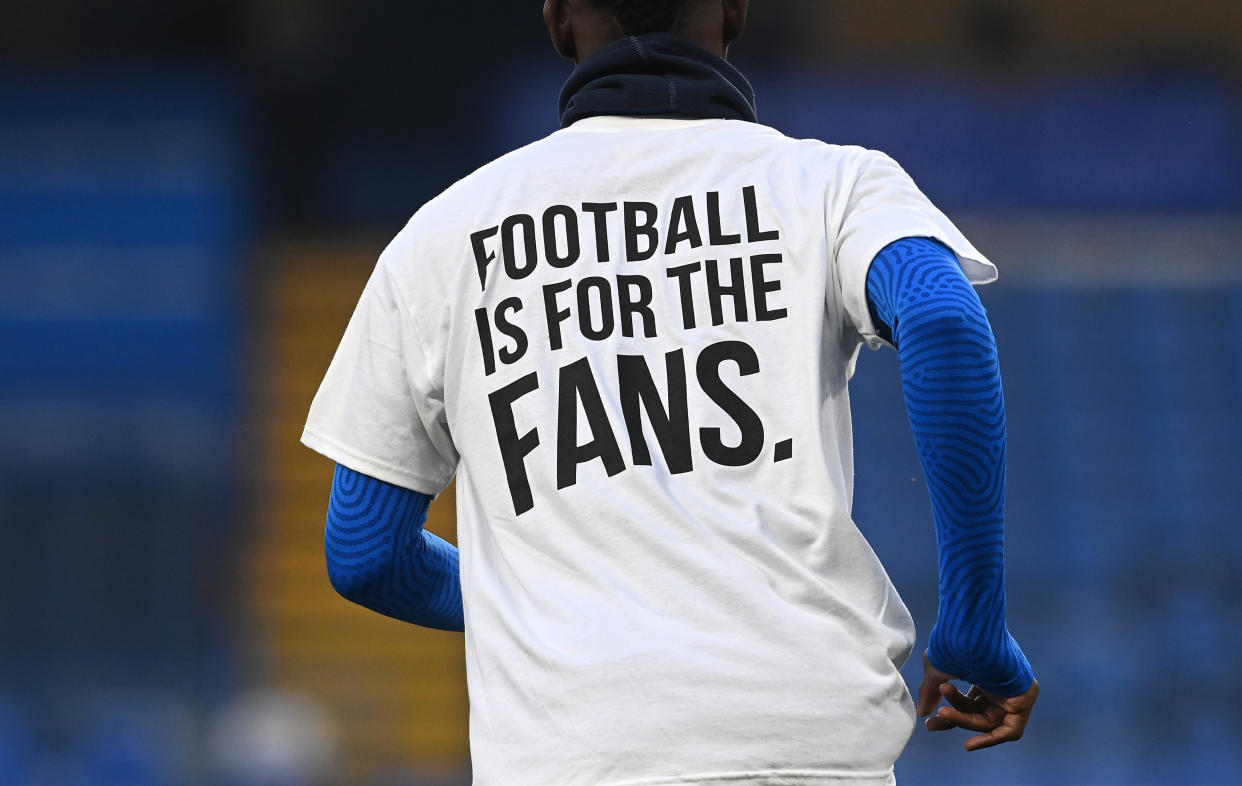 Brighton players warm up wearing a t-shirt with a message in protest against the European Super League.