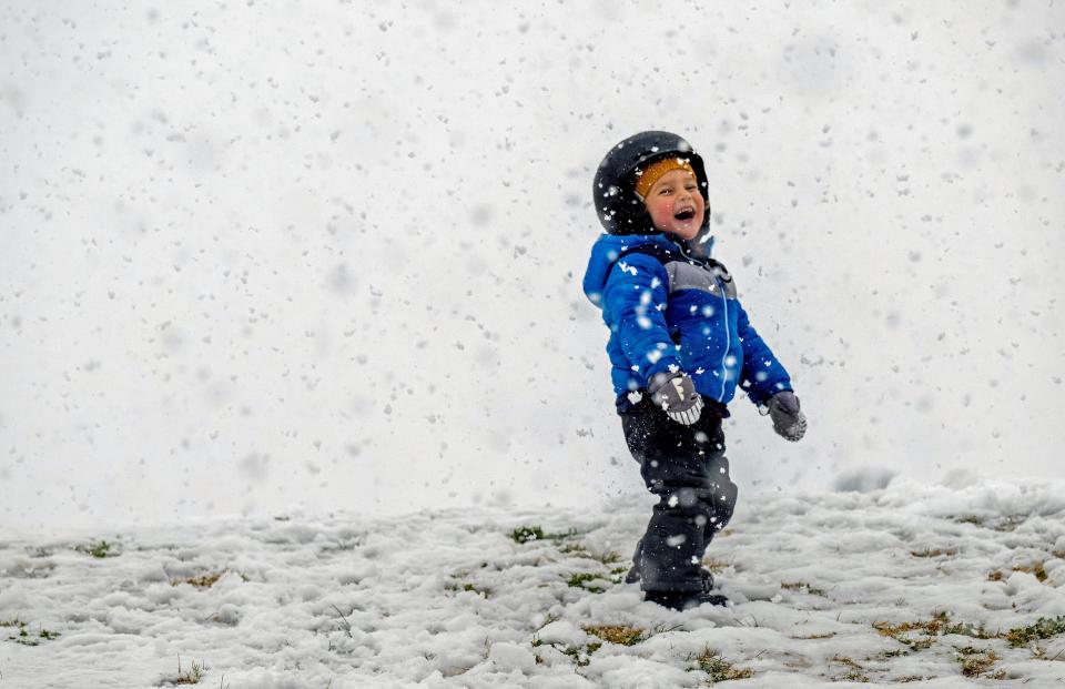 Kamal Rahm, aged three, of Carlsbad, enjoys the snow at Yucaipa Community Park in California, on Thursday (Terry Pierson/The Orange County Register via AP) (© The Press-Enterprise/SCNG)