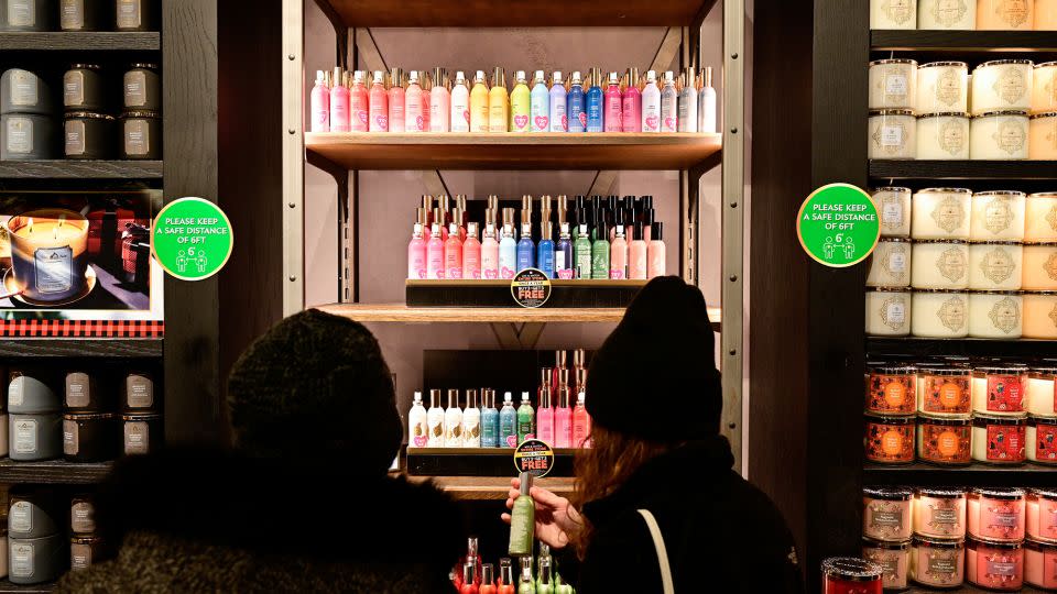 People shop in a Bath & Body Works store as Black Friday sales begin at The Outlet Shoppes of the Bluegrass in Simpsonville, Kentucky, on November 26, 2021. - Jon Cherry/Reuters