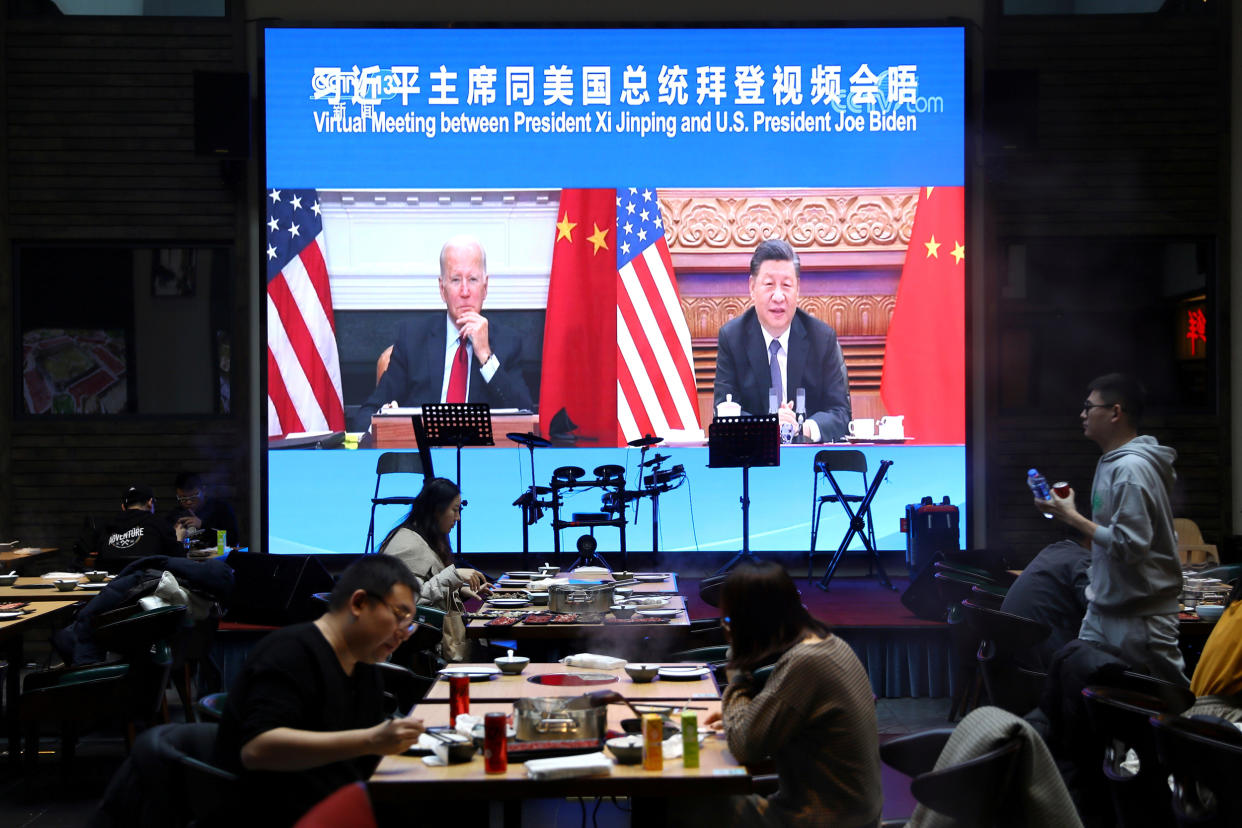 Image: FILE PHOTO: Screen shows Chinese President Xi Jinping attending a virtual meeting with U.S. President Joe Biden via video link, at a restaurant in Beijing (Tingshu Wang / Reuters)