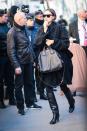 <p>Bradley Cooper’s girlfriend kept warm in a cozy black coat. <em>(Photo: Getty Images)</em> </p>