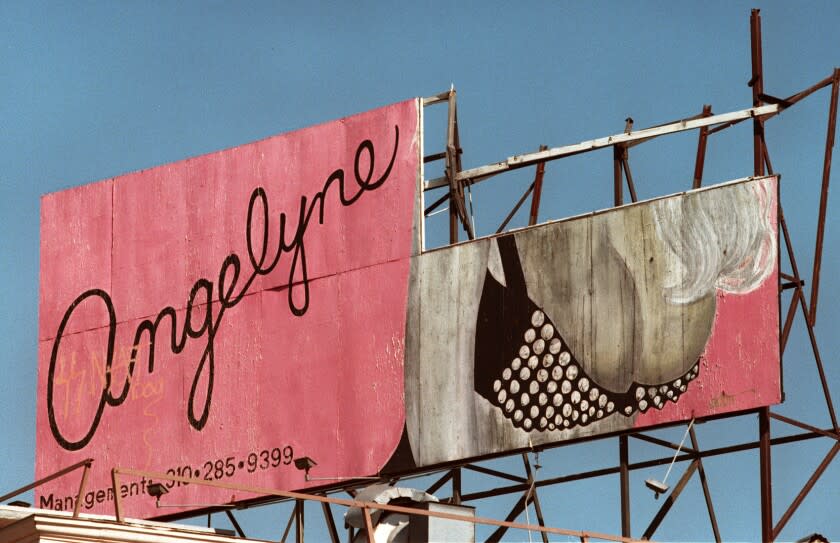 ME.ONLYLA.1.0130.RM.c Angelyne billboard at the intersection of Las Palmas Avenue and Hollywood Blvd., Los Angeles. The head portion of the billboard has fallen down leaving behind Angelyne's breasts to titillate passerbyers. Photographed on 1-30-97. Rick Meyer/LAT THURSDAY FOLDER Mandatory Credit: Rick Meyer/The LA Times