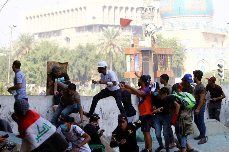 Demonstrators take part on the ongoing anti-government protests in Baghdad