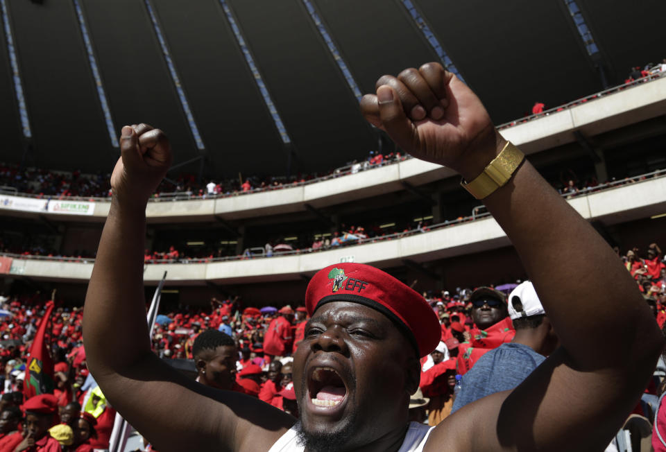 Supporters of the Economic Freedom Fighters (EFF) party, attend their election rally at the Orlando Stadium in Soweto, South Africa, Sunday, May 5, 2019, ahead of South Africa's election on May 8. (AP Photo/Themba Hadebe)