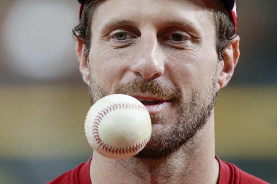 Washington Nationals starting pitcher Max Scherzer warms up during batting practice for baseball's World Series Monday, Oct. 21, 2019, in Houston. The Houston Astros face the Washington Nationals in Game 1 on Tuesday. (AP Photo/Eric Gay)