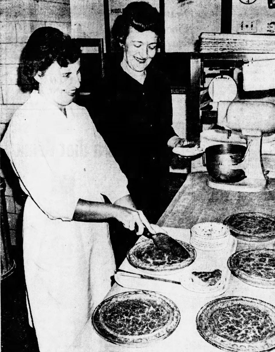 Mrs. Gertrude Cox, manager at the L.S. Ayres & Co. employee cafeteria, watches as her assistant, Mrs. James R. Wagers, prepares sugar cream pie for the serving line. The popular pie recipe was featured in the Oct. 31, 1965, Hoosier Holiday Cookbook.