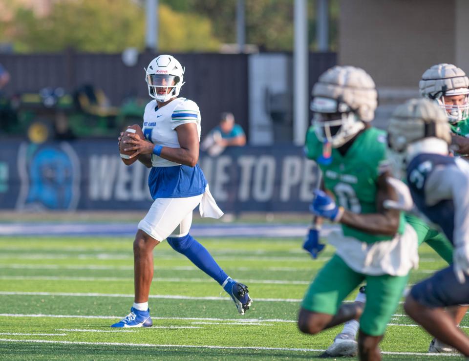 Quarterback Peewee Jarrett (7) looks for an open receiver during a football scrimmage at the University of West Florida in Pensacola on Wednesday, Aug. 23, 2023.