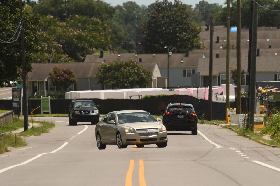 Traffic travels down Greenfield Street in Wilmington on July 28. Unshaded areas along the sidewalk were heating up to 104 degrees even as the high temperature for the day was 96 degrees.