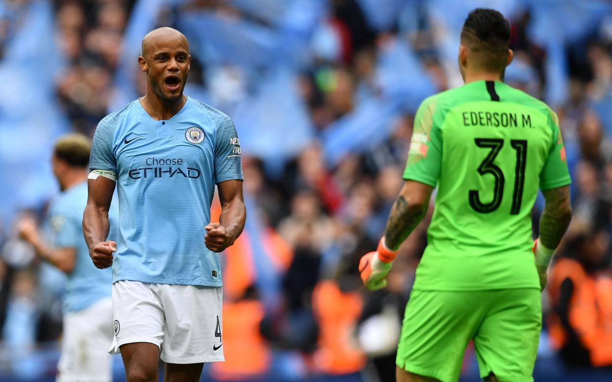 Kompany and City secured an historic domestic treble at Wembley - AFP