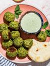 <p>Pistachios, mint, cilantro, dill, <em>and </em>parsley combine to turn these a lovely shade of green. Bonus: These <a href="https://www.delish.com/cooking/recipe-ideas/recipes/a54231/easy-homemade-falafel-recipe/" rel="nofollow noopener" target="_blank" data-ylk="slk:falafel;elm:context_link;itc:0;sec:content-canvas" class="link ">falafel</a> are baked, not fried, to make them healthier with less mess.</p><p>Get the <strong><a href="https://www.delish.com/cooking/recipe-ideas/a37048772/baked-falafel-recipe/" rel="nofollow noopener" target="_blank" data-ylk="slk:Herby Baked Falafel Bites with Spicy Mint Tahini Dip recipe;elm:context_link;itc:0;sec:content-canvas" class="link ">Herby Baked Falafel Bites with Spicy Mint Tahini Dip recipe</a></strong>.</p>