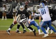 Aug 10, 2018; Oakland, CA, USA; Oakland Raiders quarterback Connor Cook (18) is pressured by Detroit Lions defensive tackle A'Shawn Robinson (91) in the second quarter during a preseason game at the Oakland-Alameda County Coliseum. Mandatory Credit: Kirby Lee-USA TODAY Sports