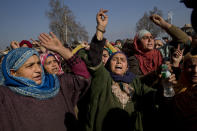 Kashmiri villagers shout freedom slogans during the funeral procession of Murtaza, a 14-year-old civilian, in Pulwama, south of Srinagar, Indian controlled Kashmir, Saturday, Dec. 15, 2018. At least seven civilians were killed and nearly two dozens injured when government forces fired at anti-India protesters in disputed Kashmir following a gunbattle that left three rebels and a soldier dead on Saturday, police and residents said. (AP Photo/ Dar Yasin)