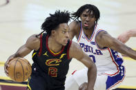 Cleveland Cavaliers' Collin Sexton (2) drives against Philadelphia 76ers' Tyrese Maxey (0) in the first half of an NBA basketball game, Thursday, April 1, 2021, in Cleveland. (AP Photo/Ron Schwane)