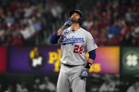 Los Angeles Dodgers' J.D. Martinez celebrates after hitting a double during the third inning of a baseball game against the St. Louis Cardinals Friday, May 19, 2023, in St. Louis. (AP Photo/Jeff Roberson)