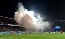 Albania's supporters throw smoke bombs and flares during the FIFA World Cup 2018 qualification football match against Italy March 24, 2017