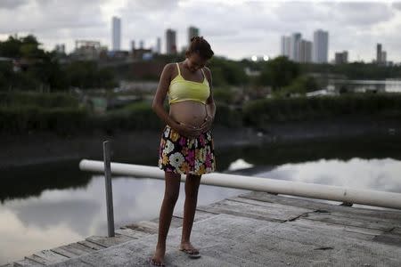 Eritania Maria, who is six months pregnant, is seen in front of her house at a slum in Recife, Brazil, February 2, 2016. REUTERS/Ueslei Marcelino