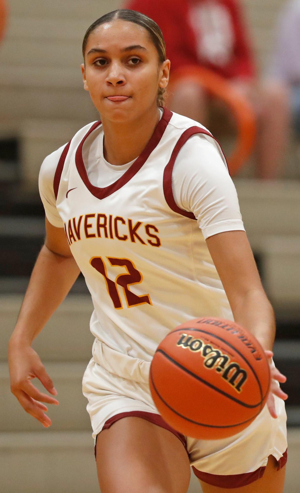 McCutcheon Mavericks Lillie Graves (12) drives to the basket during the IU Health Hoops Classic girl’s basketball seventh place game against the Lafayette Jeff Bronchos, Saturday, Nov. 18, 2023, at Harrison High School in West Lafayette, Ind. McCutcheon Mavericks won 62-32.