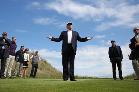 Republican presidential candidate Donald Trump speaks to the media on the golf course at his Trump International Golf Links in Aberdeen, Scotland, June 25, 2016. REUTERS/Carlo Allegri.
