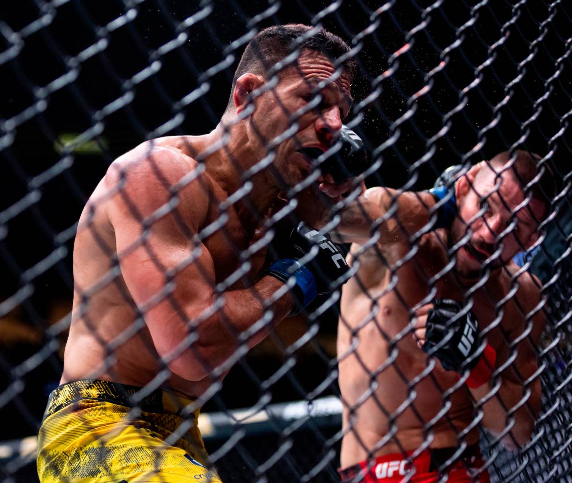 Mateusz Gamrot of Poland fights against Rafael Dos Anjos of Brazil during their lightweight title match during the UFC 299 event at the Kaseya Center on Saturday, March 9, 2024, in downtown Miami, Fla.